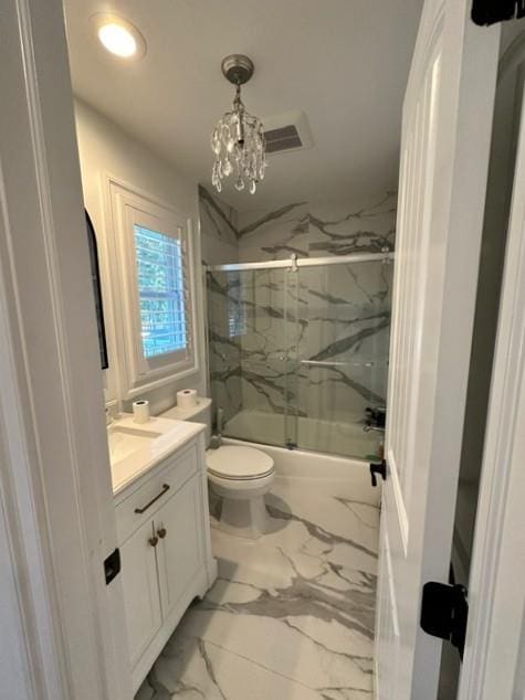 full bathroom with shower / bath combination with glass door, vanity, a chandelier, and toilet