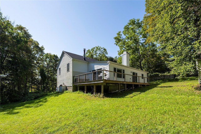 back of house with a yard and a deck