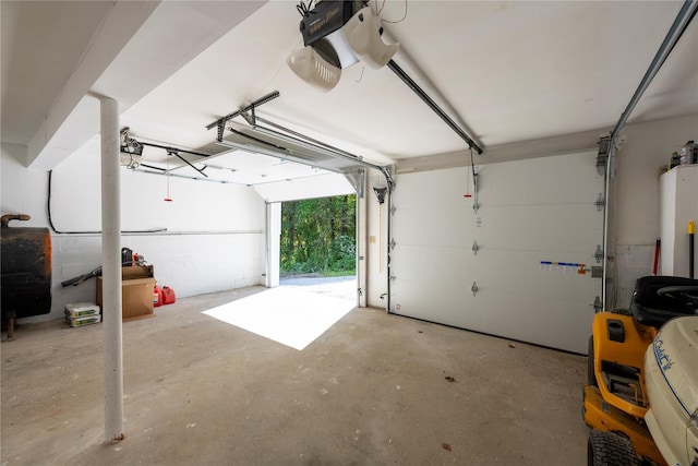 garage featuring a garage door opener and water heater