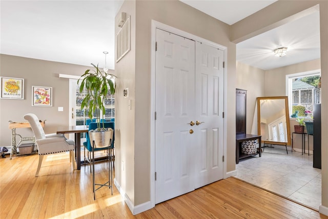 hallway featuring hardwood / wood-style flooring