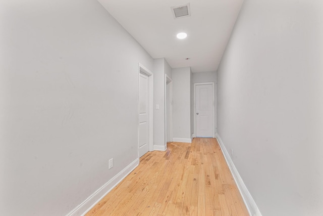 corridor featuring light hardwood / wood-style floors
