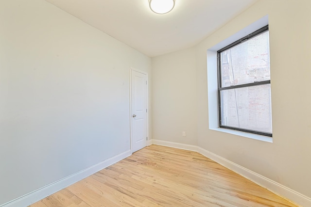 spare room featuring light hardwood / wood-style floors