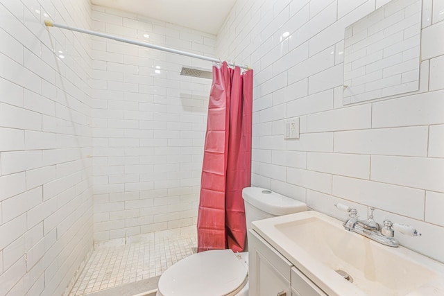 bathroom with vanity, toilet, tile walls, and a shower with curtain