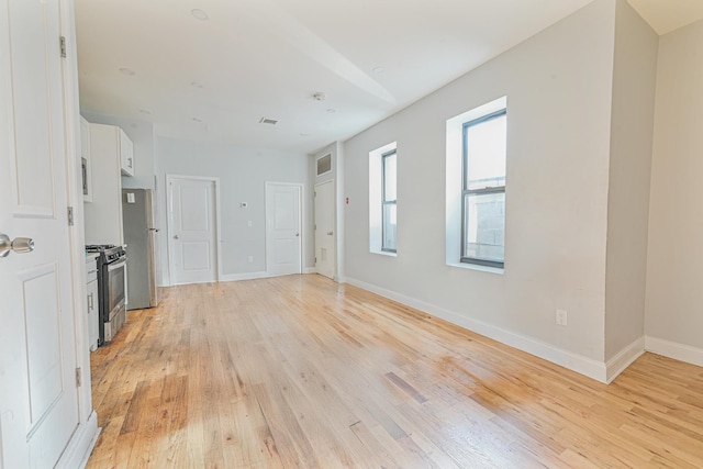 unfurnished living room featuring light wood-type flooring