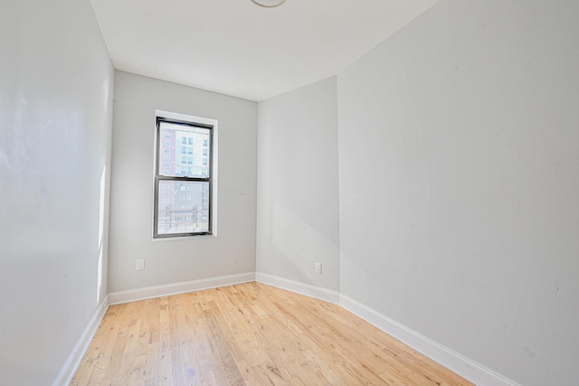 spare room with light wood-type flooring