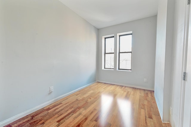 unfurnished room featuring light hardwood / wood-style floors