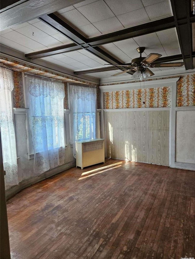 unfurnished room featuring ceiling fan, wood-type flooring, and coffered ceiling