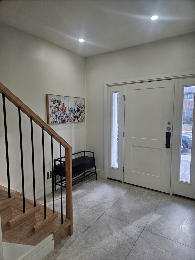 foyer entrance featuring a wealth of natural light