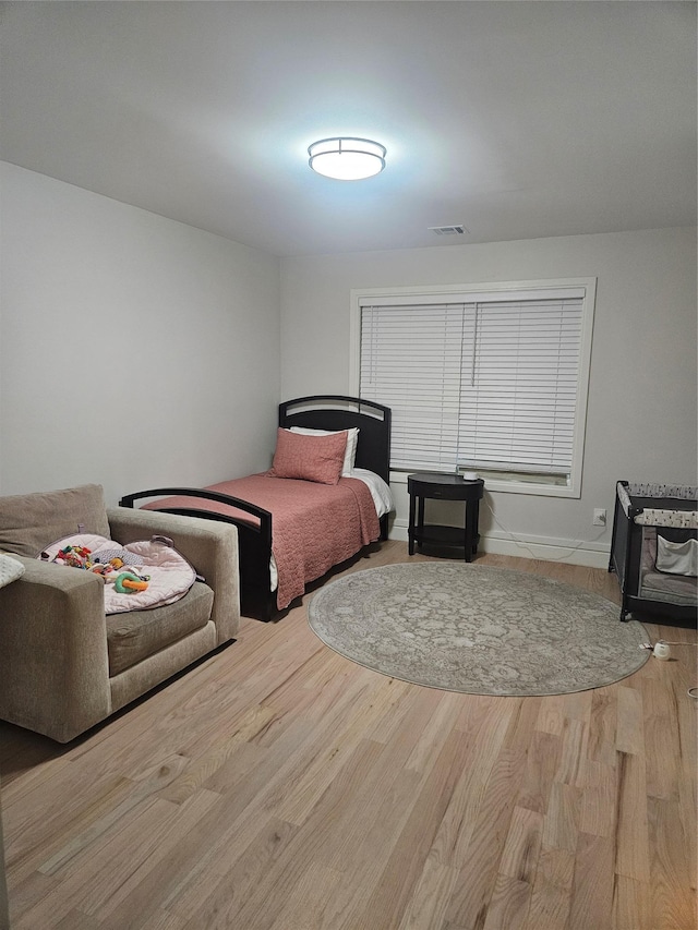 bedroom with wood-type flooring