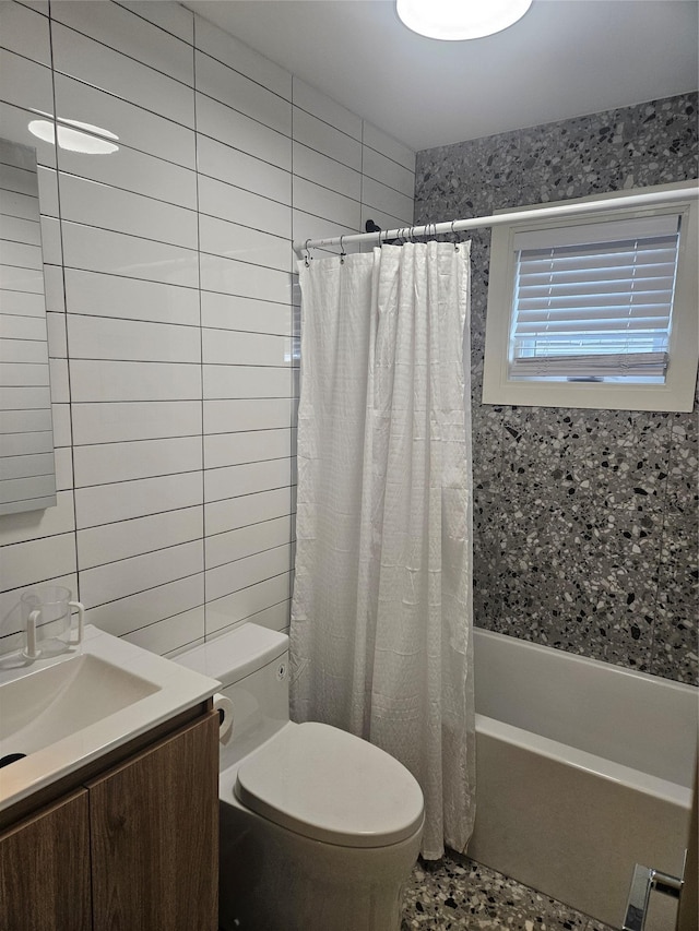 full bathroom featuring vanity, toilet, shower / bathtub combination with curtain, and tile walls