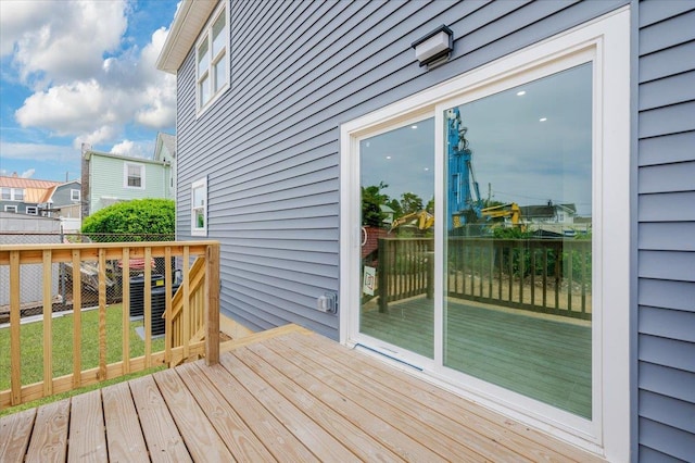 wooden deck featuring a yard