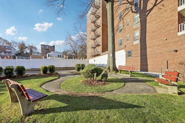 view of property's community with a yard