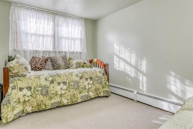 carpeted bedroom featuring a baseboard radiator