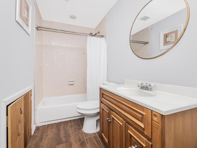 full bathroom with vanity, toilet, and shower / tub combo