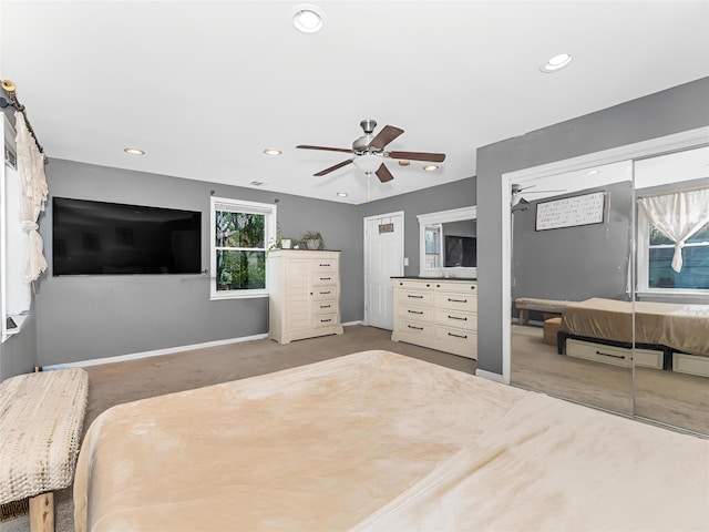 carpeted bedroom featuring ceiling fan