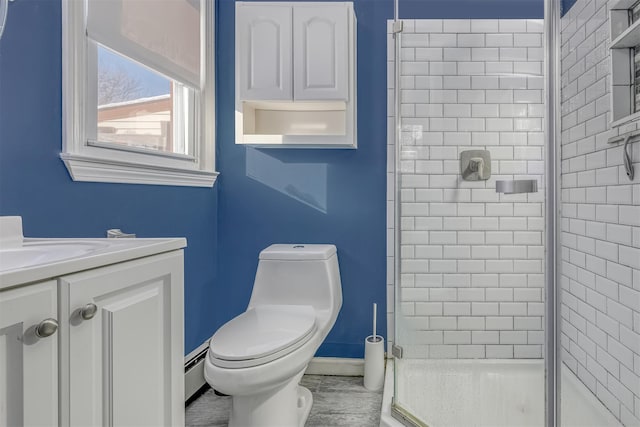 bathroom featuring baseboard heating, toilet, a shower with door, and vanity