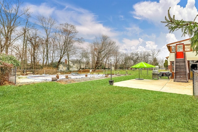 view of yard with a patio and a pool