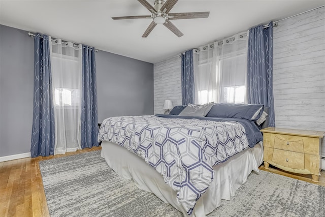 bedroom featuring hardwood / wood-style floors and ceiling fan