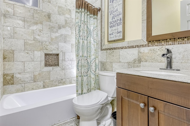 full bathroom featuring shower / tub combo, toilet, tile walls, and vanity