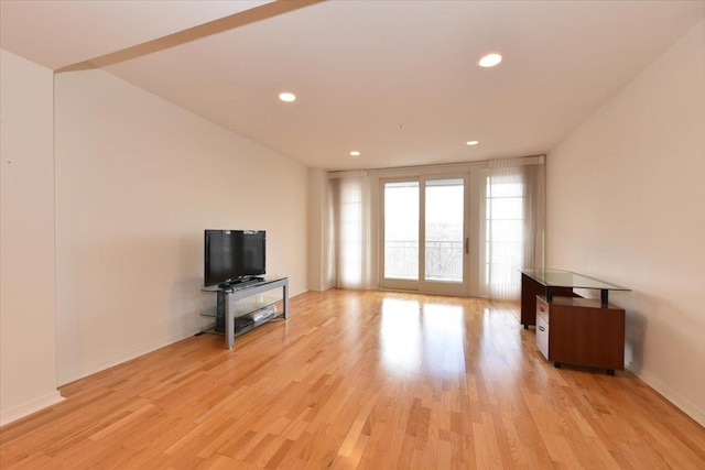 unfurnished living room with light hardwood / wood-style flooring