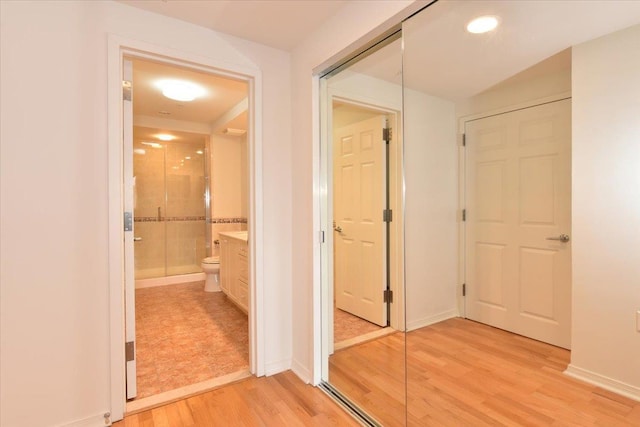 hallway featuring light wood-type flooring