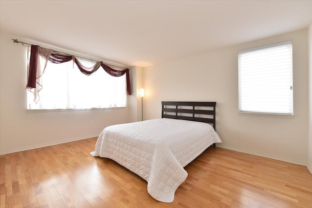 bedroom with light hardwood / wood-style flooring