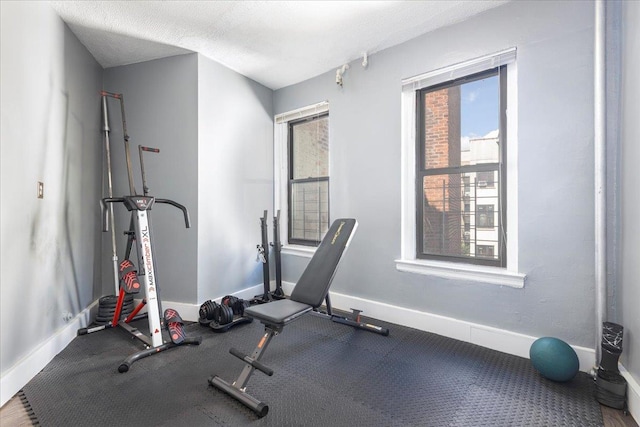 exercise area with a textured ceiling