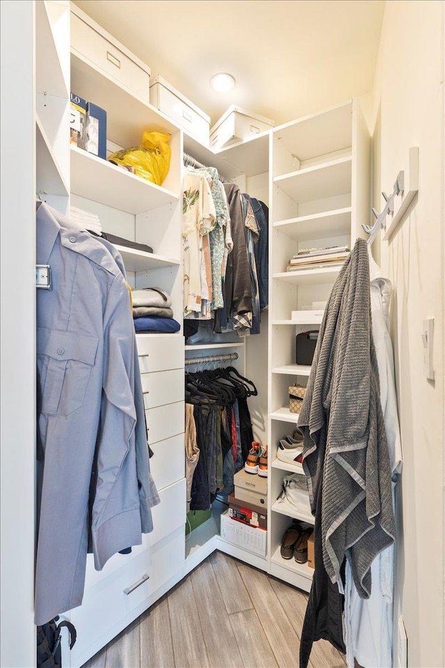 walk in closet featuring light hardwood / wood-style floors