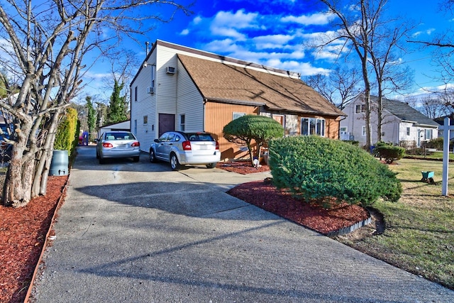 view of side of property with a garage