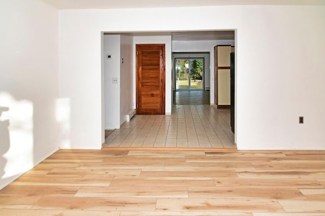 corridor featuring light hardwood / wood-style floors