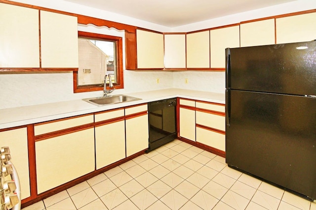 kitchen with sink, white cabinetry, and black appliances