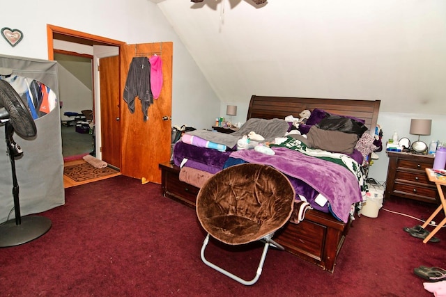 carpeted bedroom featuring ceiling fan and lofted ceiling