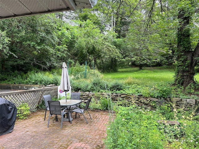 view of patio with a grill