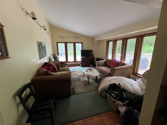 tiled living room with french doors and vaulted ceiling