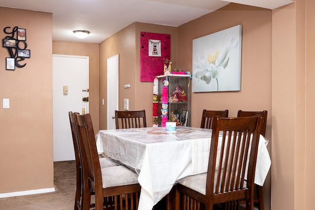 view of carpeted dining area