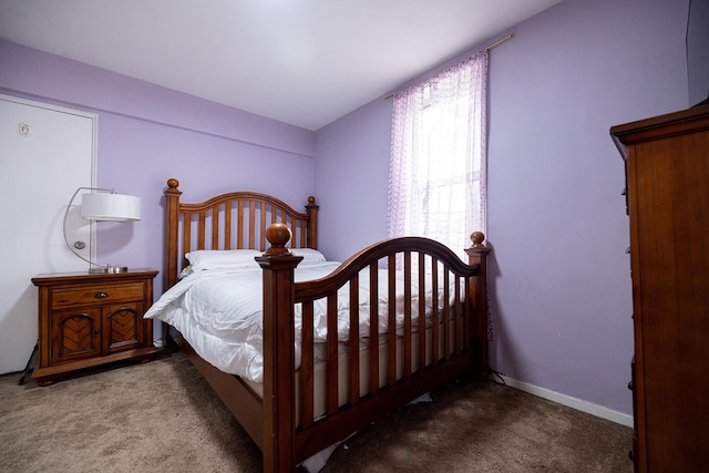 bedroom featuring light colored carpet