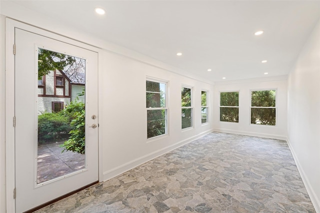 unfurnished sunroom with a healthy amount of sunlight