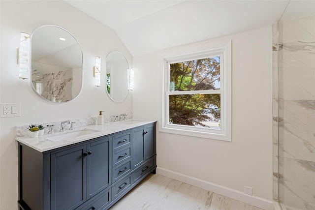 bathroom with vanity and vaulted ceiling