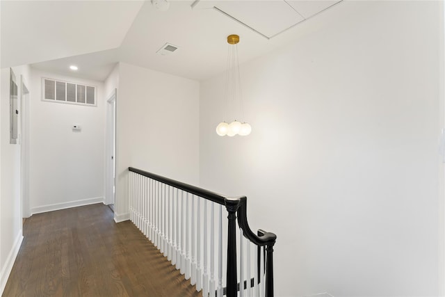 corridor featuring dark hardwood / wood-style flooring