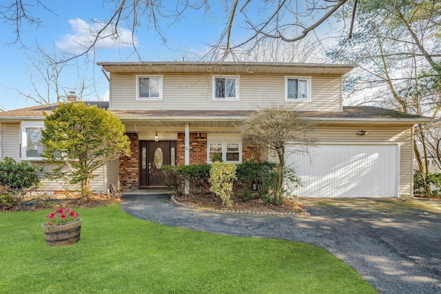 front facade with a front lawn and a garage