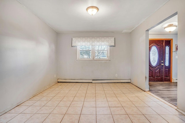 entryway with light tile patterned flooring and a baseboard radiator