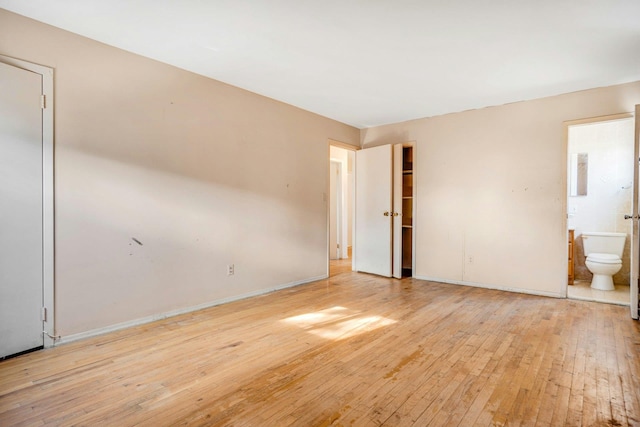 spare room with light hardwood / wood-style floors