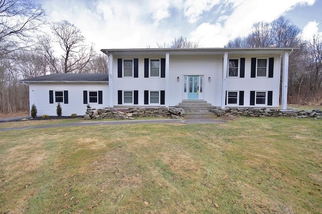 bi-level home with a front yard