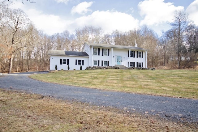 bi-level home featuring a front yard