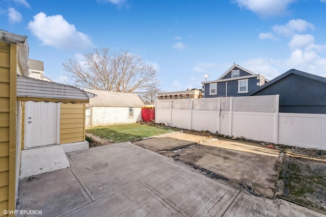 view of patio / terrace featuring a shed