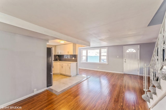 interior space with light wood-type flooring and sink