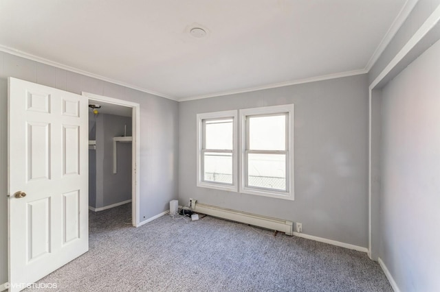 unfurnished bedroom featuring a closet, light colored carpet, ornamental molding, and a baseboard heating unit