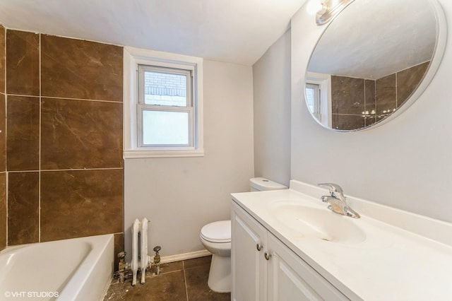 bathroom featuring tile patterned flooring, vanity, and toilet