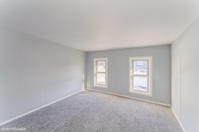 empty room featuring light colored carpet