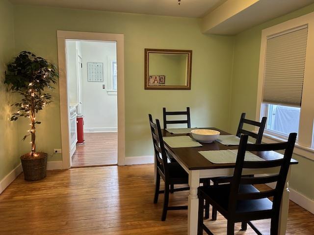 dining area with light hardwood / wood-style flooring